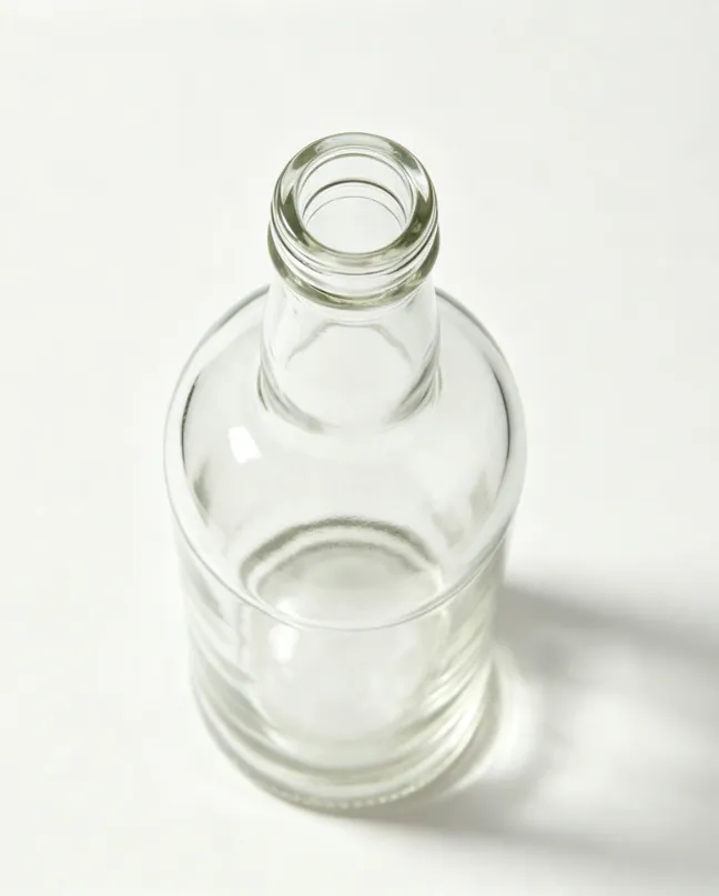 700ml empty round whiskey glass bottle flat mouth front view