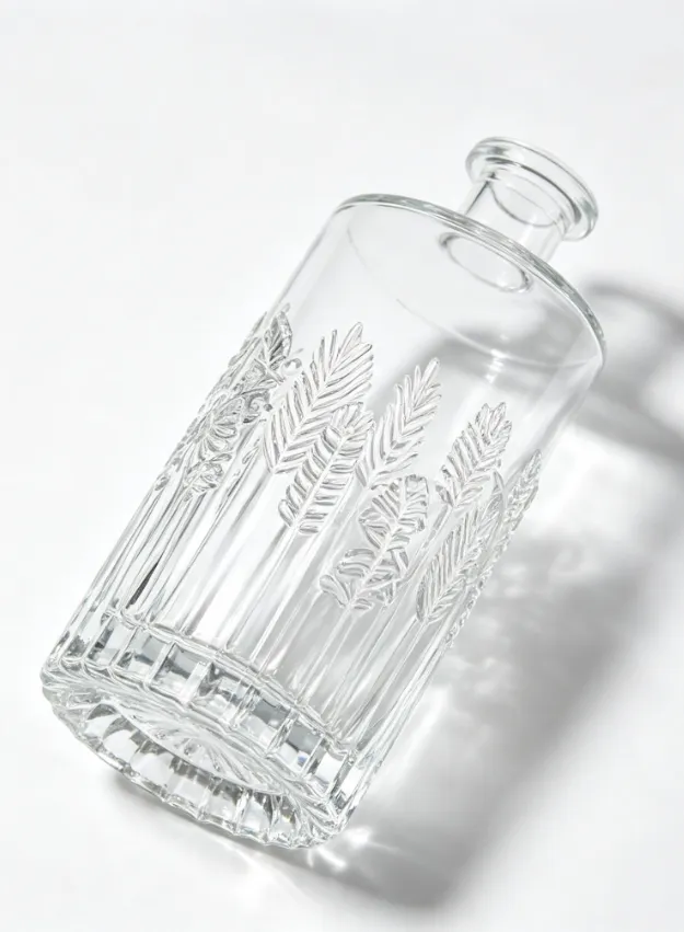 Embossed whiskey bottle 750ml with clear glass, leaf embossed texture, and premium crystal base.